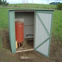Pump shed and pressure tank